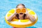 Los Angeles - kids with pieces of oranges in the pool Shot