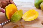 person slicing a mango | Classpop Shot