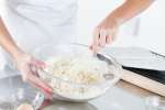 Mixing batter for castagnaccio fritters | Classpop Shot