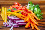 thinly sliced vegetables on a cutting board Shot