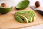 sliced avocado on a cutting board Shot