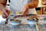 chef filling homemade potstickers Shot