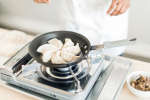 dumplings in a frying pan Shot