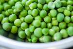 english peas in a white bowl Shot