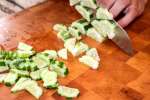 Miami - chef slicing cucumber for poke bowls Shot