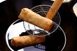 frying egg rolls Shot