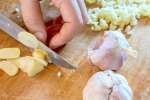 chef slicing garlic for chutney | Classpop Shot