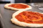 Uncooked pizza dough with sauce | Classpop Shot