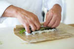 chef rolling a vegetable sushi roll | Classpop Shot