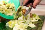 Chef plating fresh caesar salad | Classpop Shot