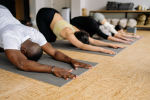 Houston - students doing child's pose in stretching class Shot