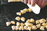 cutting fresh gnocchi Shot