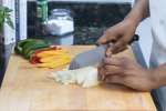 chef slicing onions and bell peppers | Classpop Shot