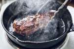 chef searing a steak in a cast iron pan | Classpop Shot