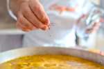 chef adding saffron to paella | Classpop Shot