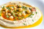 homemade hummus with paprika and parsley | Classpop Shot