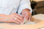 chef making lumpia rolls | Classpop Shot