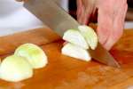 a chef slicing onions for french onion soup | Classpop Shot