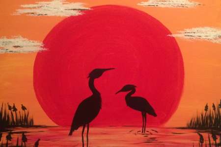 Blue Herons and the Red Sun