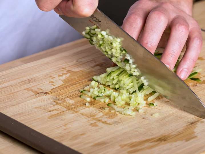 chef dicing cucumber for raita | Classpop Shot