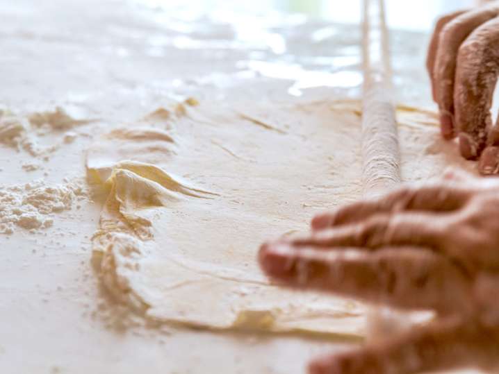 rolling dough to make baklava | Classpop Shot