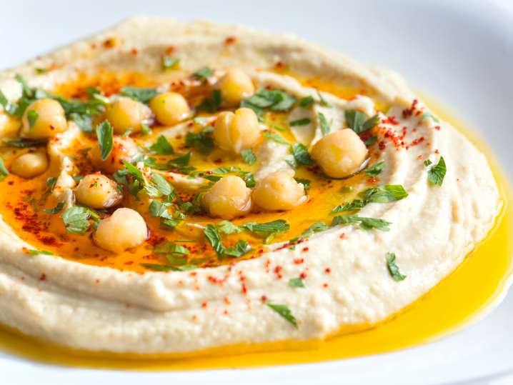 homemade hummus with paprika and parsley | Classpop Shot