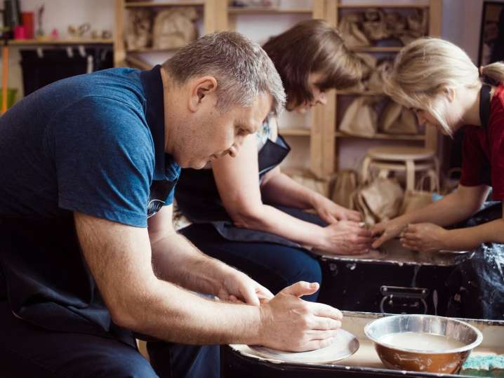 a group enjoying a pottery class Shot