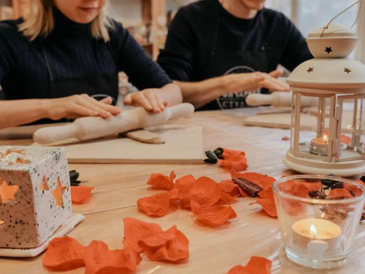 a couple shaping pottery in pottery class Shot