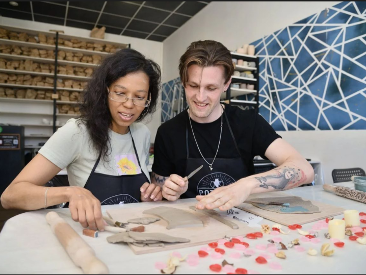 a couple in pottery class Shot