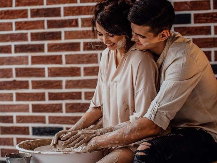 couple doing pottery together Shot