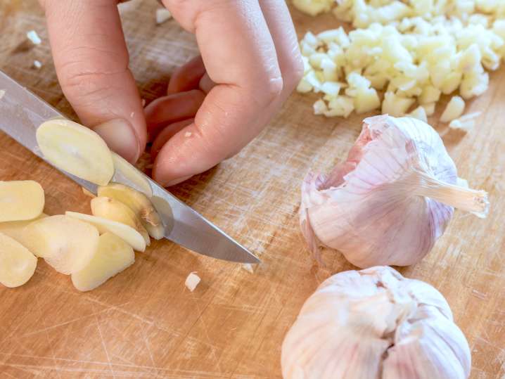 Ottawa - chef slicing garlic for gnocchi sauce Shot