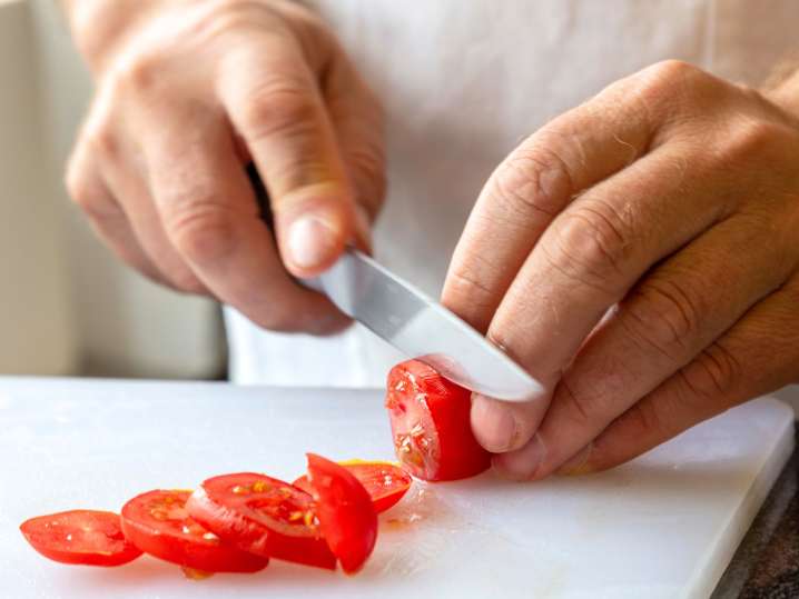 Cutting tomatoes Shot