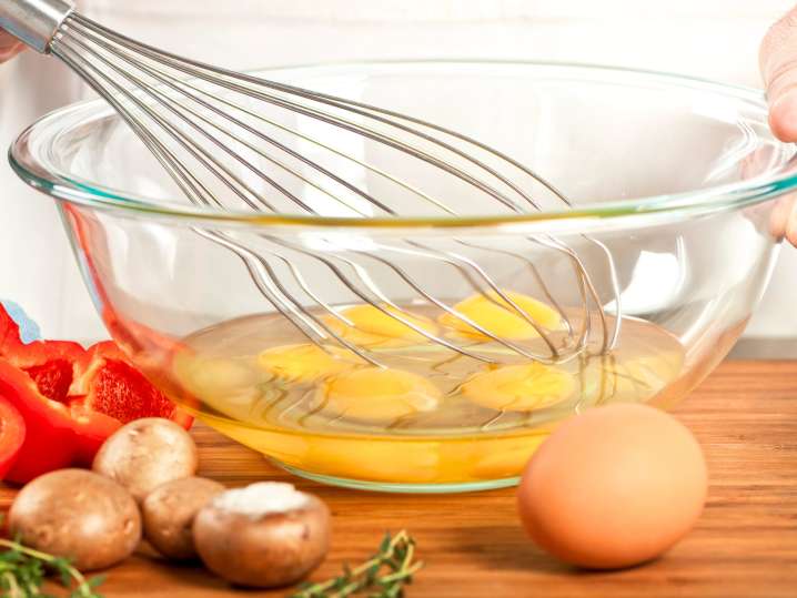 Whisking eggs for Spanish omelette Shot