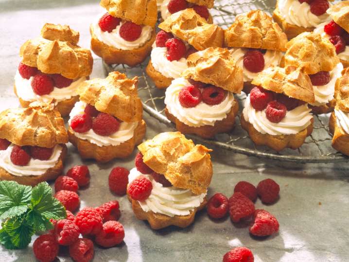 Cream puffs with fresh raspberries Shot