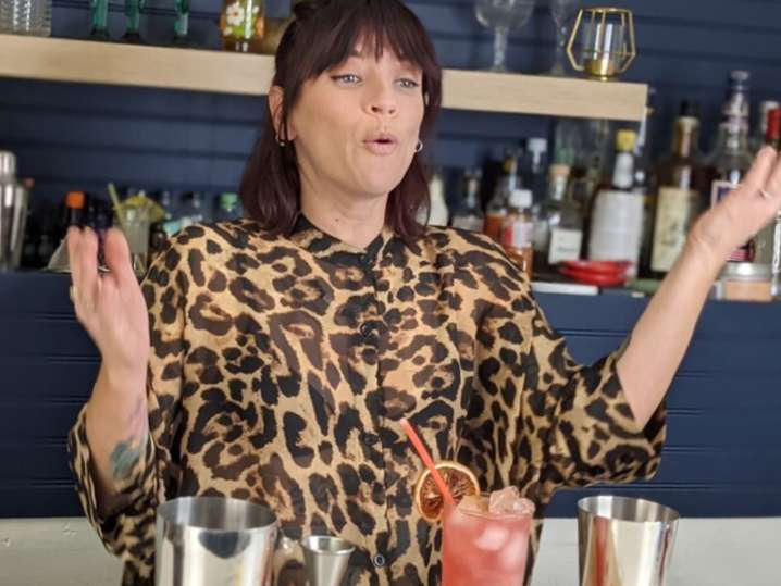 Los Angeles - a woman explaining mixology Shot