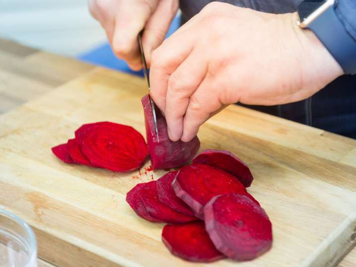 Cutting roasted beetroots Shot