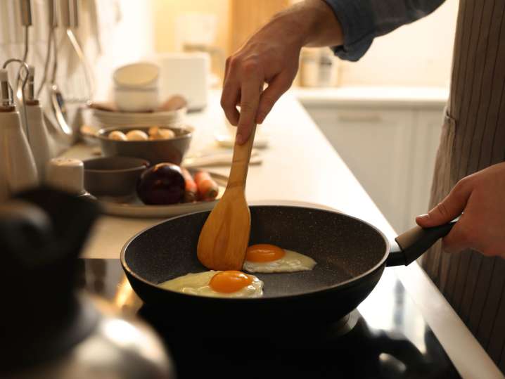 Pan frying sunny side up egg Shot