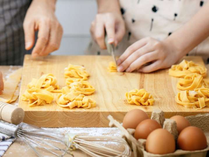 Cutting and shaping tagliatelle pasta dough Shot