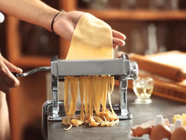 Using pasta machine for pasta making Shot