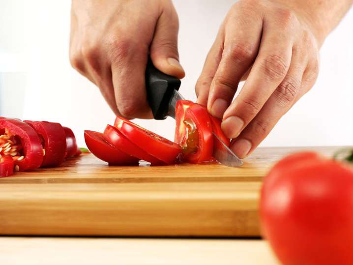 Cutting tomatoes Shot