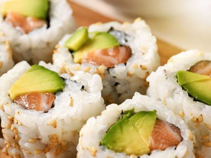 Salmon and avocado sushi rolls Shot