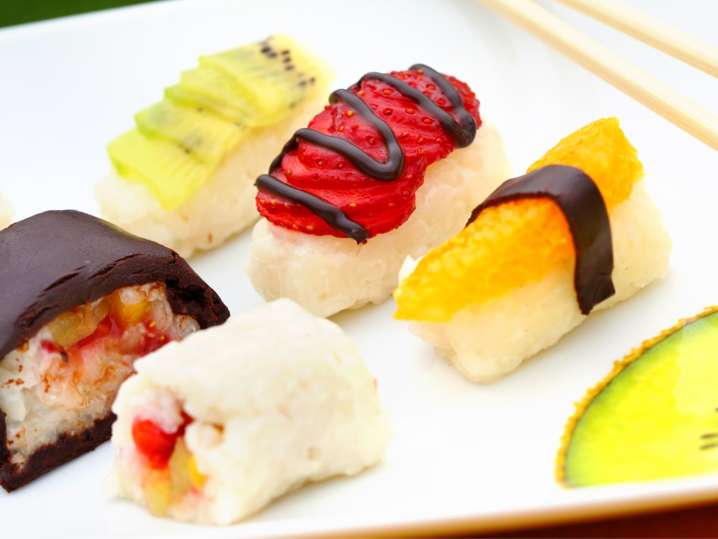 Dessert sushi with fruit and chocolate drizzle Shot
