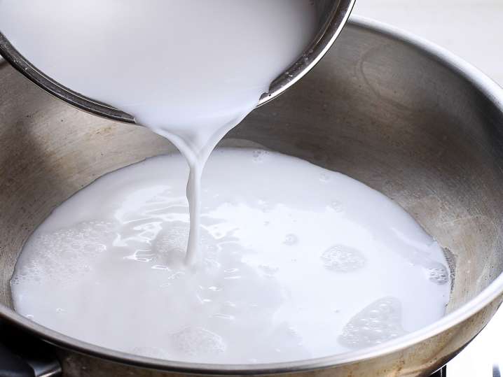 Pouring coconut milk Shot