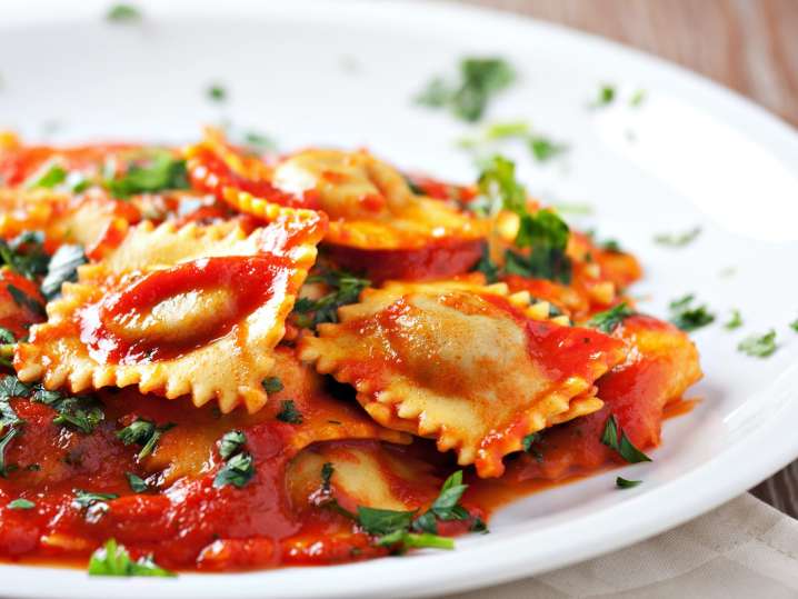 Fresh ravioli with marinara sauce Shot