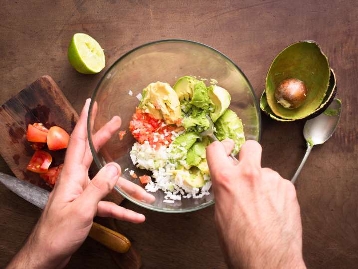 Making fresh guacamole Shot