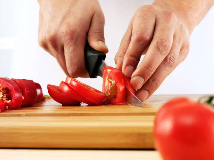 Cutting tomatoes Shot