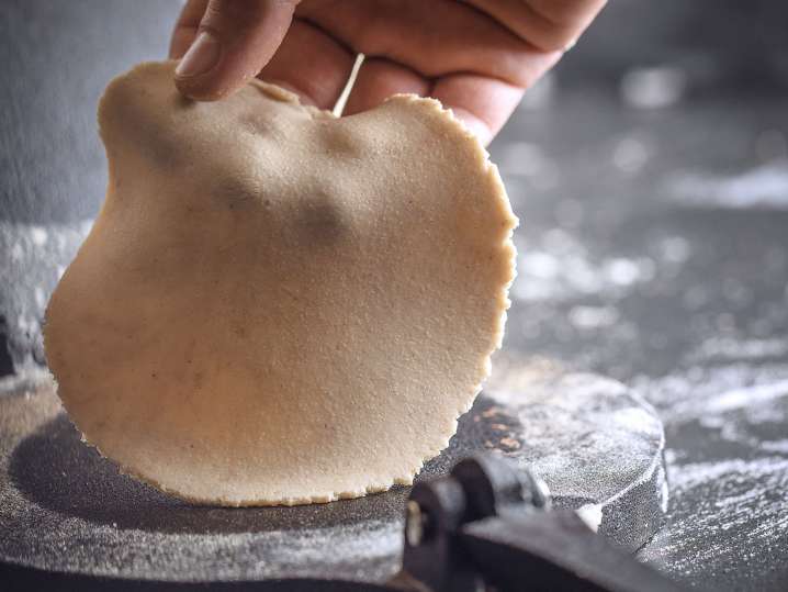 Making fresh tortillas using a press Shot