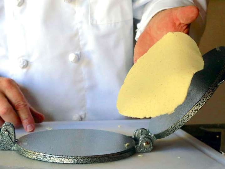 Making fresh tortillas using a press Shot