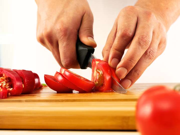 Cutting tomatoes Shot