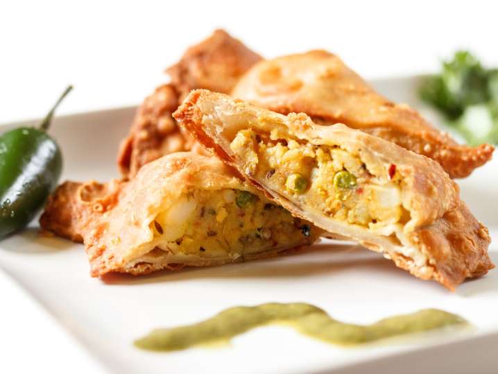 Vegetarian samosas with green chutney Shot